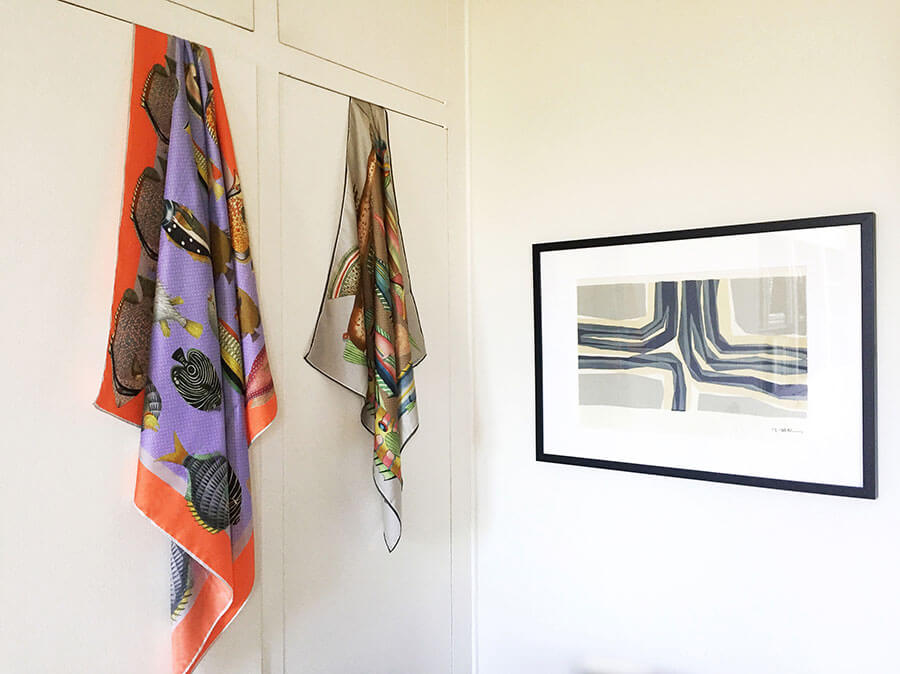 colorful fish motif scarves hanging on the wall