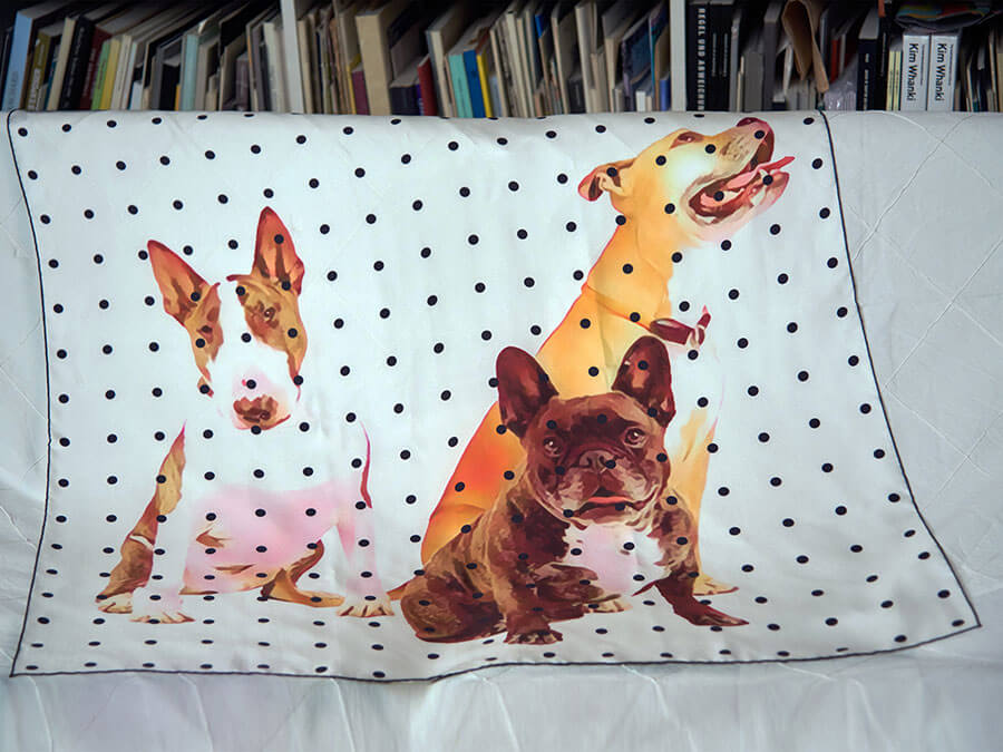dogs and polka dot printed silk scarf on sofa