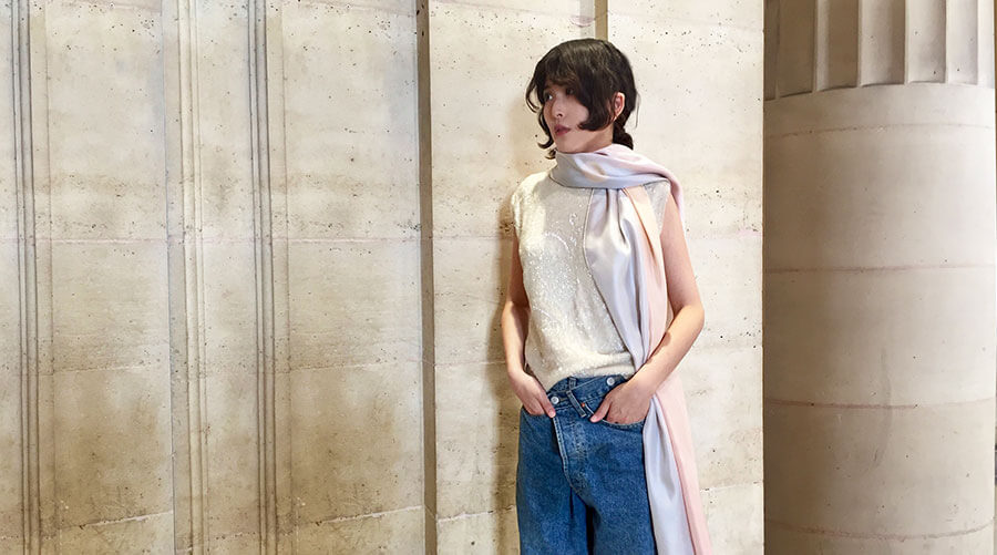 woman wearing long silk scarf with pink and blue photo