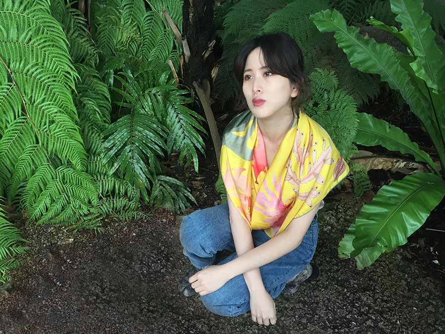 algae printed yellow silk scarf on a woman in jungle