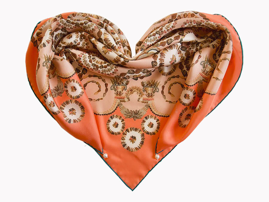 shell printed orange silk scarf folded in heart