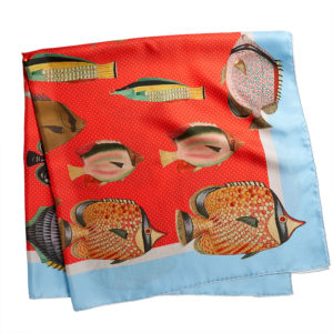 printed red silk twill scarf with colorful fishes folded