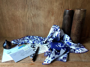 printed blue silk scarf with letters photos and pen