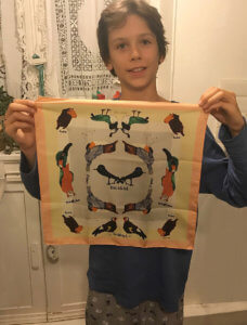 little boy with custom made scarf of his drawing