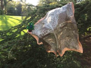 silk scarf on a pine tree with little christmas tree