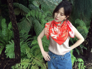 algae printed red silk scarf on a woman in forrest