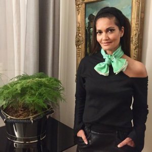 green arabesque punted silk scarf tied as a bow