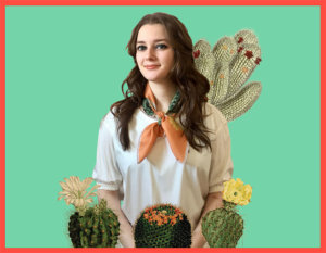 woman with cactus printed terra-cotta color scarf tied