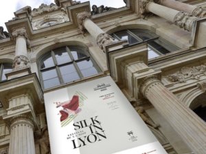 silk in lyon poster on palais de la bourse in lyon