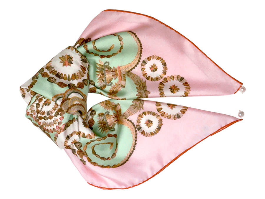 Seashell printed silk scarf folded like a fish