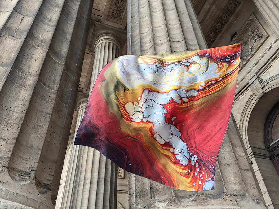 colorful custom made scarf with painting with columns in the background