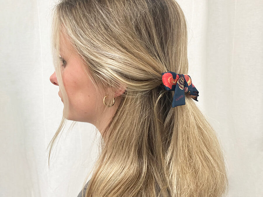 lady with blond hair wearing a Silk French Barrette